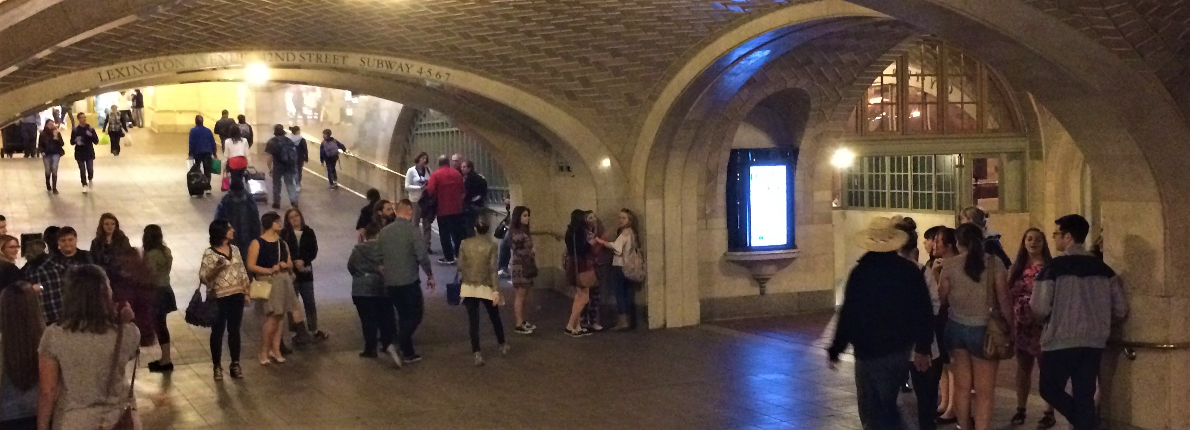 Crowds of people in Grand Central Terminal's Whispering Gallery located just outside the Oyster Bar.