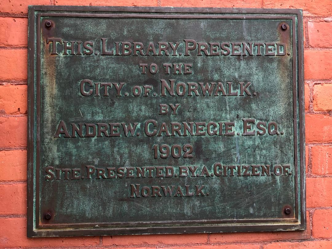Plaque on Norwalk Connecticut library indicating it was presented to the people of Norwalk in 1902 by Andrew Carnegie.